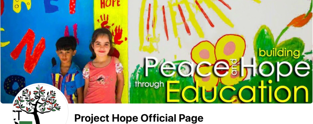 A child standing in front of a wall with a painted banner

AI-generated content may be incorrect.